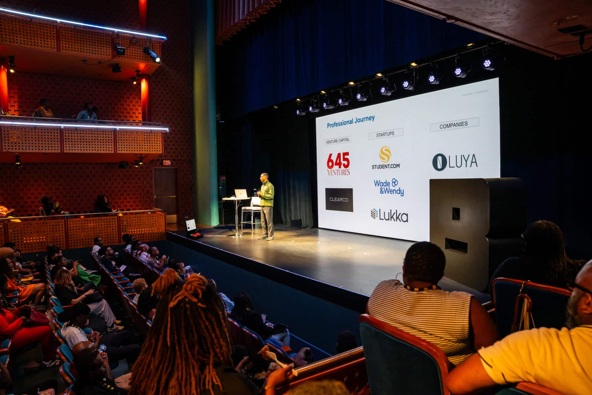 A presenter speaking on stage at Black Tech Week 2025 with AV production and scenic LED provided by Colortone
